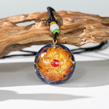 Load image into Gallery viewer, Golden lotus flower and lapis lazuli orgonite necklace from The Orgone Shop. 