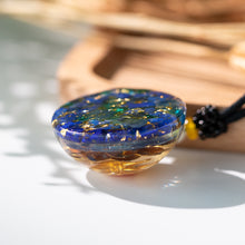 Load image into Gallery viewer, Golden lotus flower and lapis lazuli orgonite necklace from The Orgone Shop. 