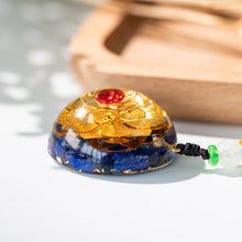 Load image into Gallery viewer, Golden lotus flower and lapis lazuli orgonite necklace from The Orgone Shop. 