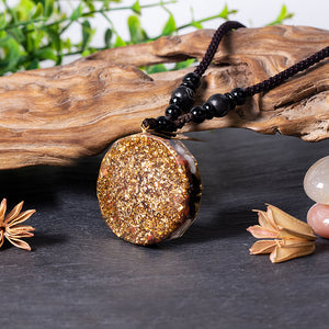 Rear view of Mermaid's Tale orgonite necklace with obsidian and howlite stones from The Orgone Shop.