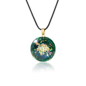 Iridescent orgonite necklace with a gold tree of life, surrounded by malachite stones from The Orgone Shop.