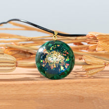 Load image into Gallery viewer, Iridescent orgonite necklace with a gold tree of life, surrounded by malachite stones from The Orgone Shop.