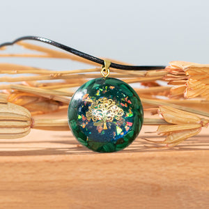 Iridescent orgonite necklace with a gold tree of life, surrounded by malachite stones from The Orgone Shop.